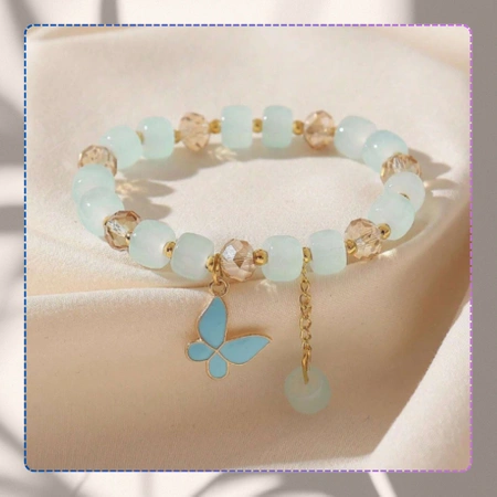 Bratara de dama albastra cu margele cu pandantiv fluture pe o banda elastica