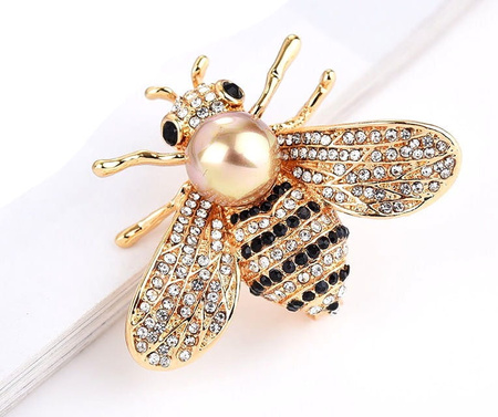 Frumoasa brosa de albina aurie cu o perla