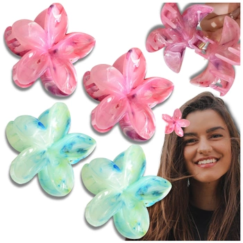 Un set de 4 bucăți de agrafe de păr cu flori de plumeria colorate